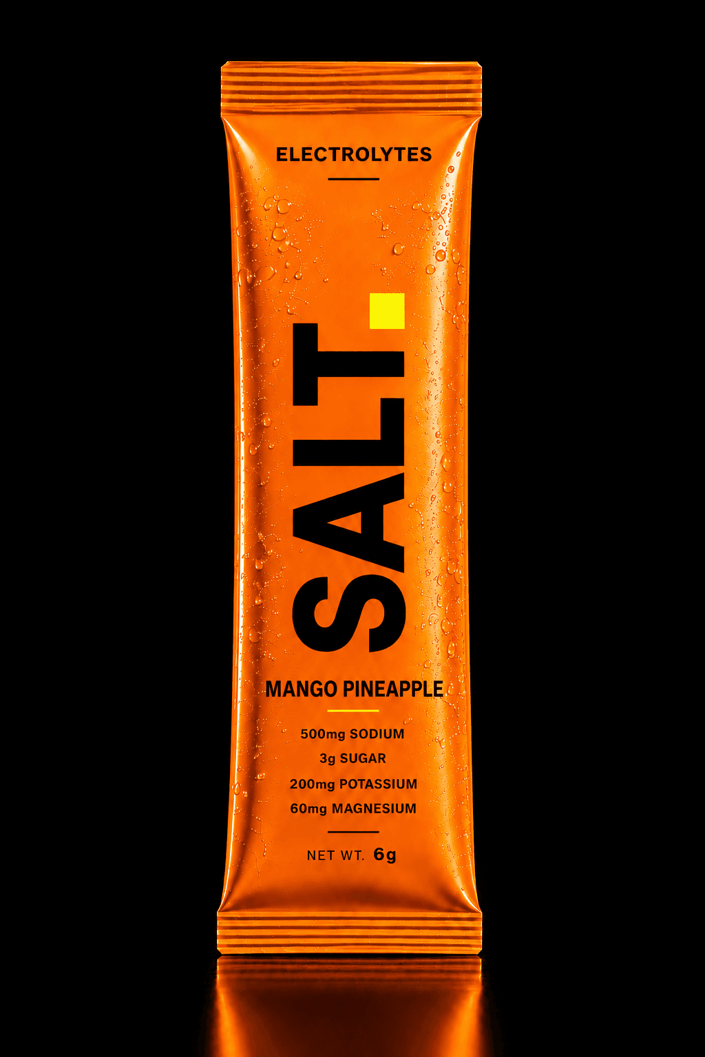 SALT Mango Pineapple sachet — vivid orange pack on a dark stage, 500mg sodium, 3g sugar per serve.
